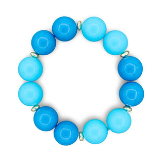 Blue beaded bracelet on a white background