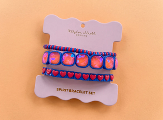 Set of colorful bracelets on a branded card with a beige background