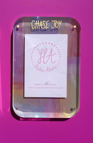 Acrylic magnetic photo frames with Chase Joy in metallic ink text and monogram inserts, displayed side-by-side against a vibrant magenta background. Find at southernquirks.com Southern Quirks